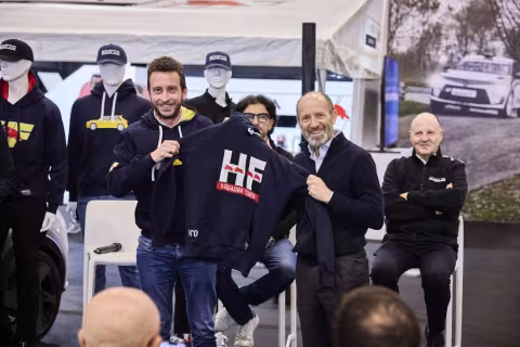 The HF Look is Back in Style: The New Lancia and Sparco Co-branded Sportswear Line Introduced at the “Rally Racing Meeting”